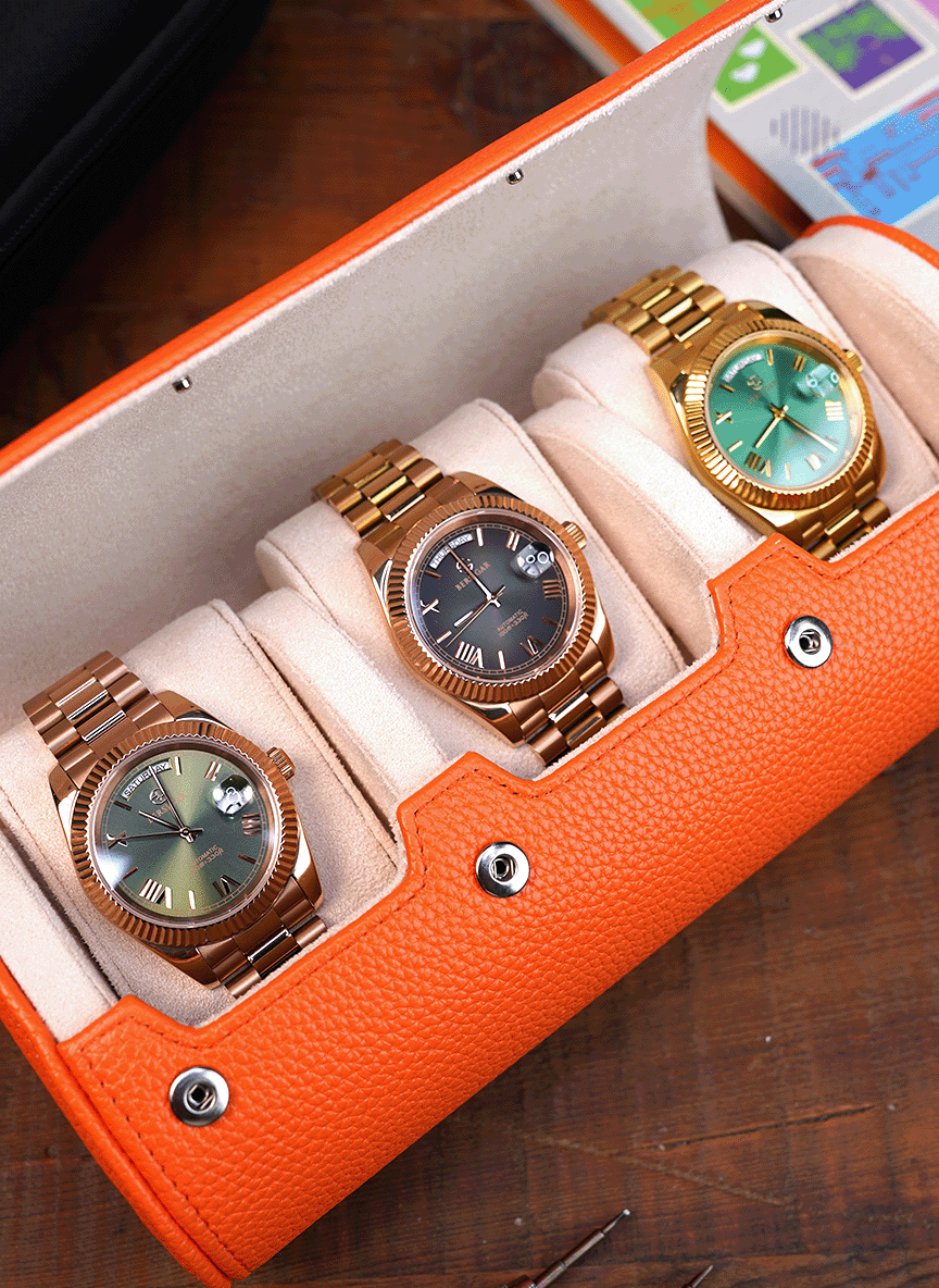 Estuche naranja para relojes: tres relojes